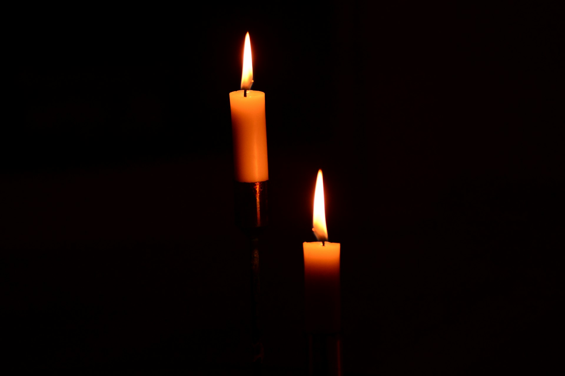 lighted candles in dark room